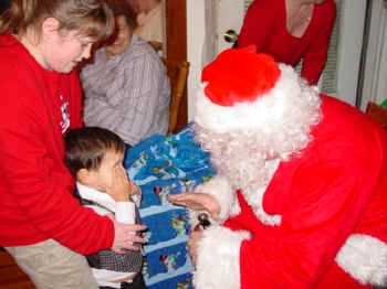 Steph with Pierce talking to Santa